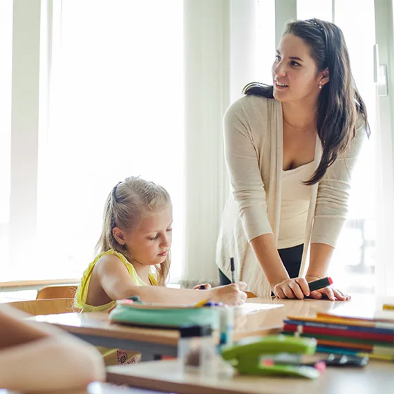 Dvss 570 0001 female teacher leaning upon table looking away